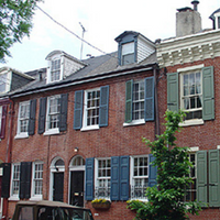 At left a Federal-style rowhome