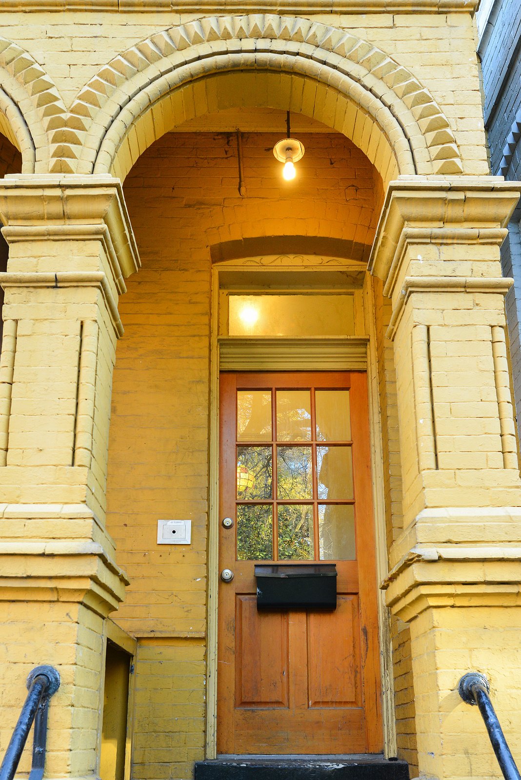 Approaching-the-front-door-of-a-historic-brick-home-Renaissance-Development-Washington-DC