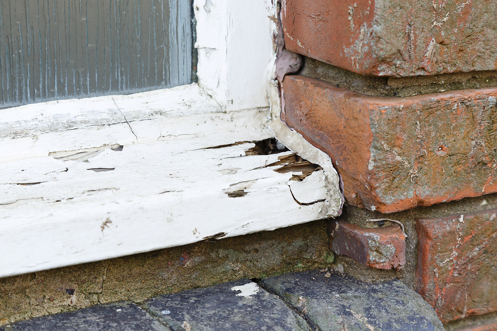 Closeup-Of-A-Rotten-Old-Wooden-window-sill-brick-mortar-renaissance-development-dc