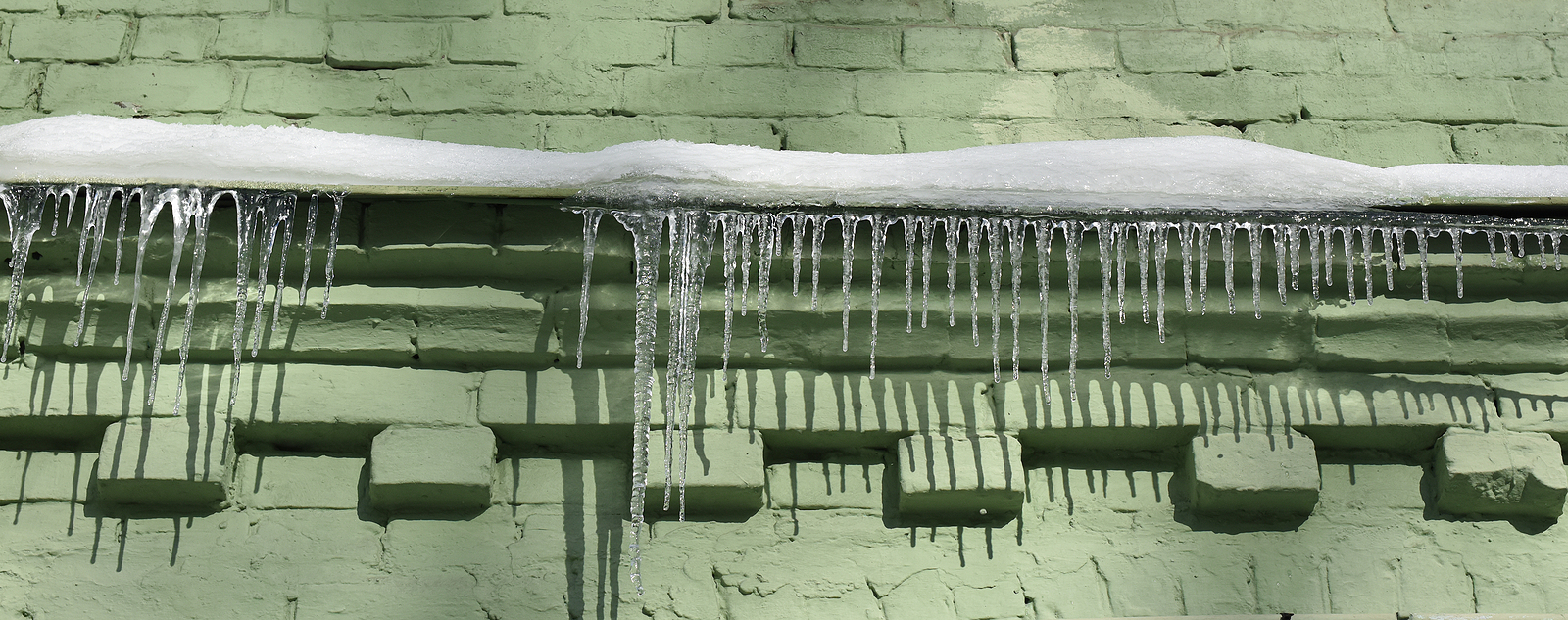 Ice and Snow on a Historic Brick Façade